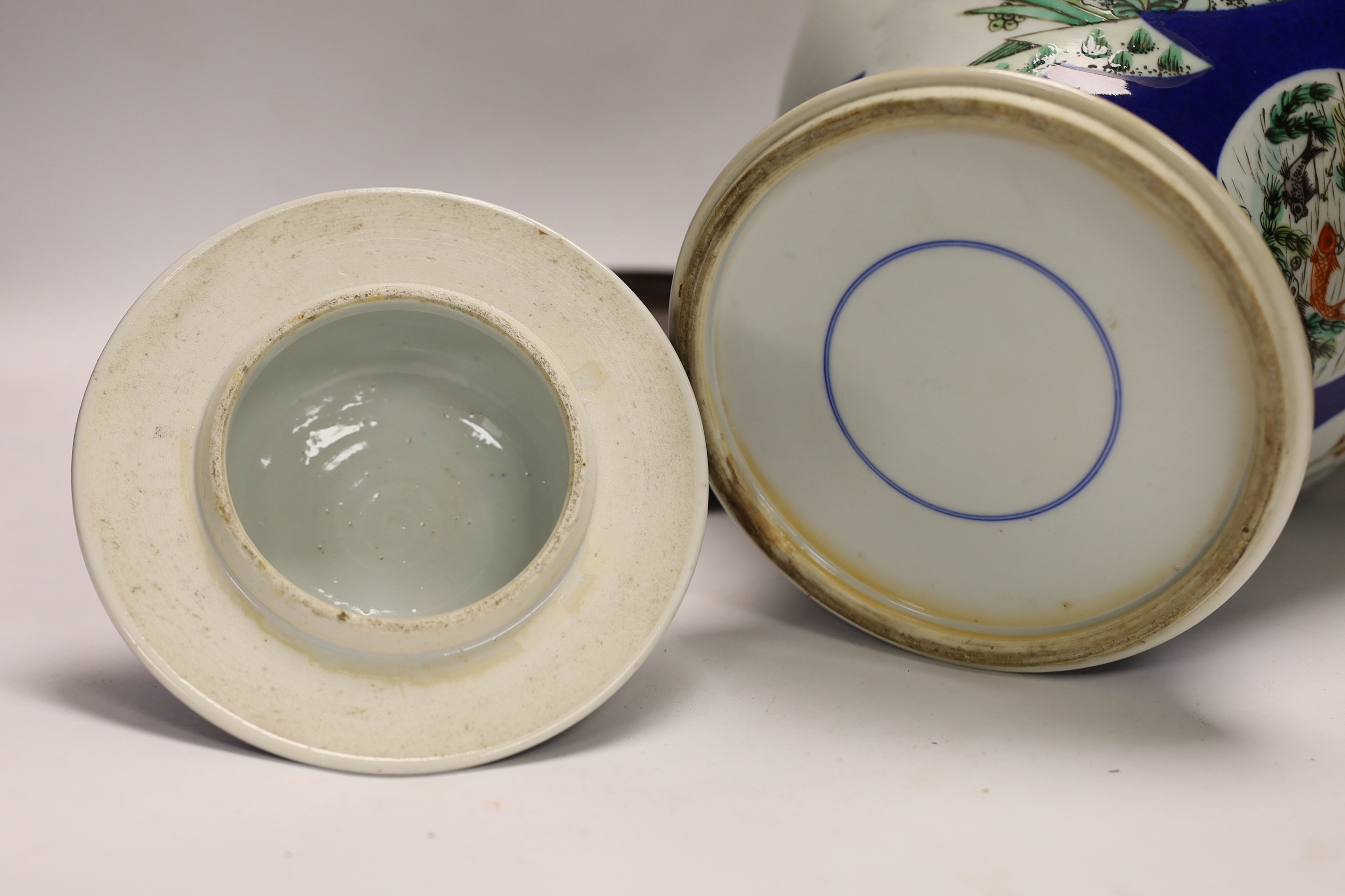 A Chinese powder blue vase and cover, Guanxu period, on wooden stand, 44cm